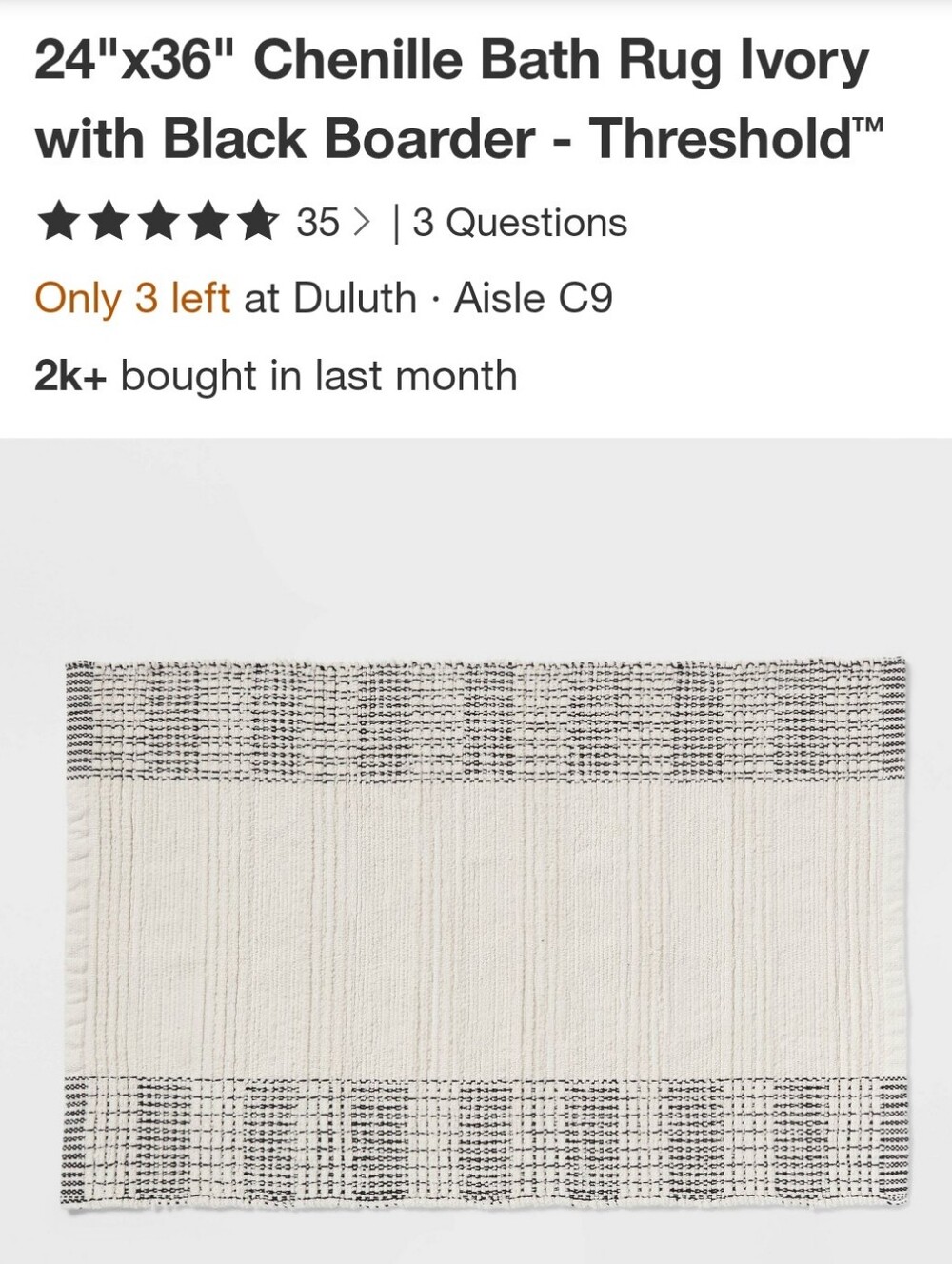 Threshold Ivory Chenille Bath Rug with Black Trim